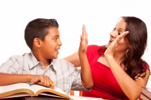 Attractive Hispanic Mother and Son Studying