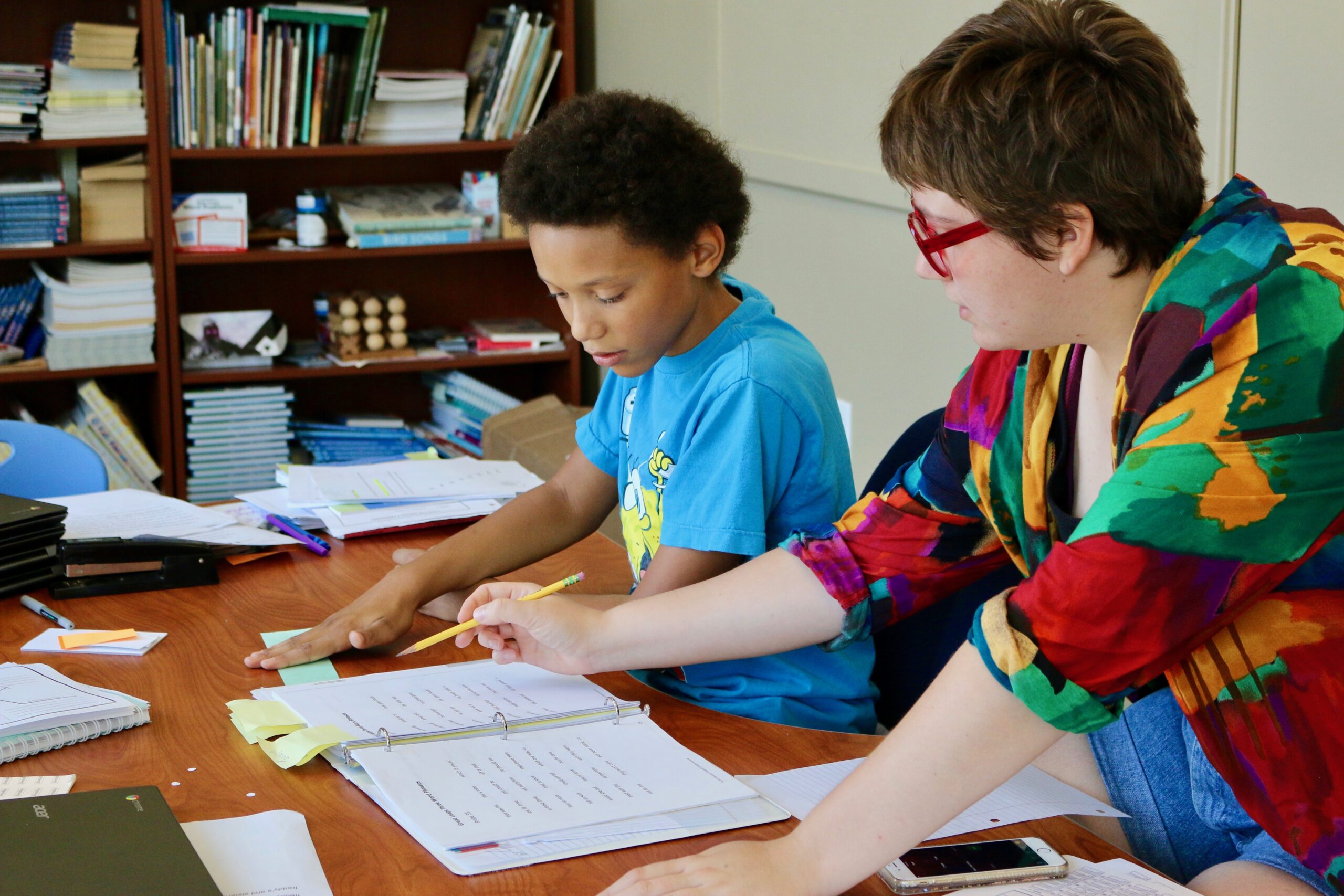 Joseph Was Losing Confidence In His Reading Ability And Struggling To Keep Up With His Classmates. Teacher and boy learning to read.
